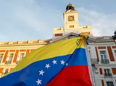 epa11553434 A Venezuelan flag flutters during a demonstration against the official results of Venezuela's presidential elections, in Madrid, Spain, 17 August 2024. The Venezuelan National Electoral Council (CNE) ratified the victory of Nicolas Maduro in Venezuela's presidential elections held on 28 July 2024, while the opposition have been protesting against the official results claiming the victory of Edmundo Gonzalez Urrutia. EPA/FERNANDO ALVARADO