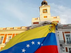 epa11553434 A Venezuelan flag flutters during a demonstration against the official results of Venezuela's presidential elections, in Madrid, Spain, 17 August 2024. The Venezuelan National Electoral Council (CNE) ratified the victory of Nicolas Maduro in Venezuela's presidential elections held on 28 July 2024, while the opposition have been protesting against the official results claiming the victory of Edmundo Gonzalez Urrutia. EPA/FERNANDO ALVARADO
