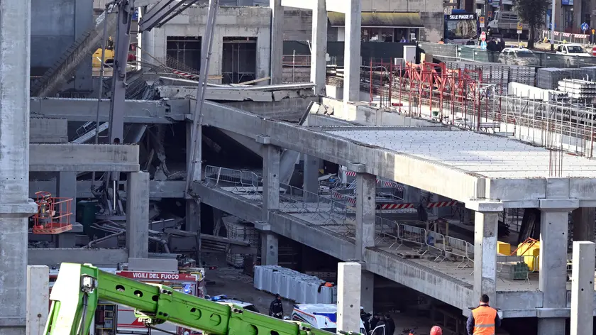 Rescue workers at the construction site where a collapse occurred in Florence, Italy, February 16, 2024. Two workers died and others are missing after a structural collapse on Friday at a supermarket construction site in Florence, local officials said. ANSA/CLAUDIO GIOVANNINI