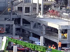 Rescue workers at the construction site where a collapse occurred in Florence, Italy, February 16, 2024. Two workers died and others are missing after a structural collapse on Friday at a supermarket construction site in Florence, local officials said. ANSA/CLAUDIO GIOVANNINI