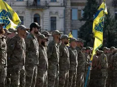 epa11503767 Servicemen of the Azov battalion attend a ceremony to remember the victims of the Olenivka camp explosion, on the Independence Square in Kyiv, 28 July 2024, amid the Russian invasion. On 29 July 2022 a building housing Ukrainian prisoners of war in Olenivka, eastern Ukraine, was destroyed, killing more than 50 people. According to Ukraine, the majority of the prisoners were soldiers from the Azovstal complex of Mariupol. Ukraine and Russia accused each other of being behind the attack. EPA/SERGEY DOLZHENKO