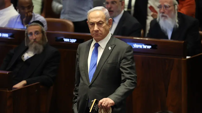 epaselect epa11403053 Israeli Prime Minister Benjamin Netanyahu (C) attends the Knesset plenum vote on the ultra-Orthodox conscription to military service law, in the Knesset, Israeli parliament in Jerusalem, 10 June 2024. The Knesset vote on the controversial exemption for ultra-Orthodox Yeshiva students from military conscription. Israel’s Supreme Court heard on 02 June a response by the state over the ultra-Orthodox recruitment issue, after previously extending a deadline for the government to present a conscription plan for ultra-Orthodox Jews, who are traditionally exempt from military service. EPA/ABIR SULTAN
