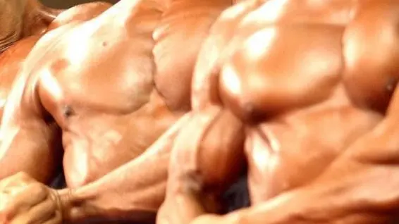 epa000228725 Body builiders compete during the group's field final during the Korea Body Building Championships 2004 held in the Olympic Stadium in the southern part of Seoul, South Korea, Thursday 08 July 2004. EPA/JOON SOO KIM