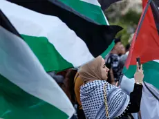 epa11277104 Protesters hold Palestinian flags during a pro-Palestinian rally called by the Palestinian Community and the 'Plataforma Valencia Amb Palestina' platform held at Valencia's City Hall square in Valencia, eastern Spain, 13 April 2024. More than 33,600 Palestinians and over 1,450 Israelis have been killed, according to the Palestinian Health Ministry and the Israel Defense Forces (IDF), since Hamas militants launched an attack against Israel from the Gaza Strip on 07 October 2023, and the Israeli operations in Gaza and the West Bank which followed it. EPA/Kai Foersterling
