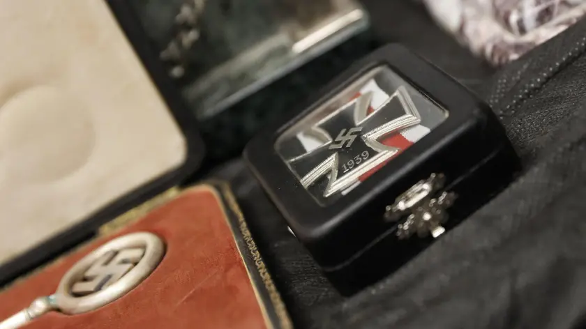 epa06038304 Detail of artifacts bearing Nazi symbols that were recovered by the Argentine Federal Police (PFA), displayed during an event at the headquarters of the Delegation of Argentinean Israeli Associations (DAIA) in Buenos Aires, Argentina, 19 June 2017. The DAIA decorated the Minister of Security Patricia Bullrich and the Federal Police of Argentina for their successful investigation that managed to recover a collection of 75 original artifacts, of German, Chinese, Japanese and Egyptian origin, that are of great interest for their historical value. Among the relics are some bearing Nazi symbolism, including a bust of German dictator Adolf Hitler and a sculpture of the imperial eagle. According to reports, investigators believe that the objects have entered Argentina through the Nazi hierarchies that took refuge in the South American country after World War II. EPA/DAVID FERNANDEZ