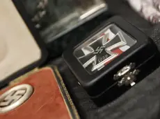 epa06038304 Detail of artifacts bearing Nazi symbols that were recovered by the Argentine Federal Police (PFA), displayed during an event at the headquarters of the Delegation of Argentinean Israeli Associations (DAIA) in Buenos Aires, Argentina, 19 June 2017. The DAIA decorated the Minister of Security Patricia Bullrich and the Federal Police of Argentina for their successful investigation that managed to recover a collection of 75 original artifacts, of German, Chinese, Japanese and Egyptian origin, that are of great interest for their historical value. Among the relics are some bearing Nazi symbolism, including a bust of German dictator Adolf Hitler and a sculpture of the imperial eagle. According to reports, investigators believe that the objects have entered Argentina through the Nazi hierarchies that took refuge in the South American country after World War II. EPA/DAVID FERNANDEZ