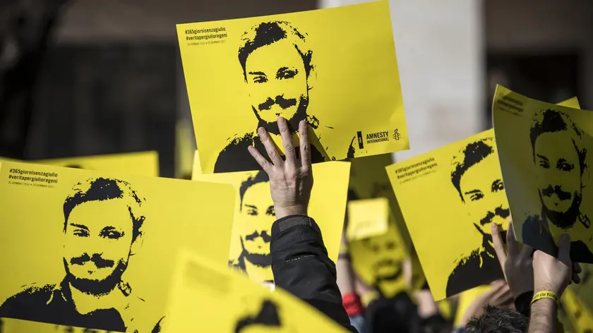 People hold signs depicting Giulio Regeni and reading ''365 days without Giulio'' as they attend a march in memory of the Italian researcher at Sapienza University on the first anniversary of his disappearance in Egypt, Rome, Italy, 25 January 2017. Italian President Sergio Mattarella on the same day called for cooperation to bring the killers of Regeni in Egypt to justice. 'Italy has mourned the killing of one of its studious young people, Giulio Regeni, without full light being shed on this tragic case for a year, despite the intense efforts of our judiciary and our diplomacy', Mattarella said on the first anniversary of Regeni's disappearance. 'We call for broader and more effective cooperation so that the culprits are brought to justice'. Guilio Regeni was an Italian PhD student researching the independent trade unions in Egypt, he disappeared on 25 January 2016 in Cairo, then his body was found in a ditch on Cairo-Alexandria road outside of Cairo on 03 February 2016 with signs of torture. ANSA/MASSIMO PERCOSSI