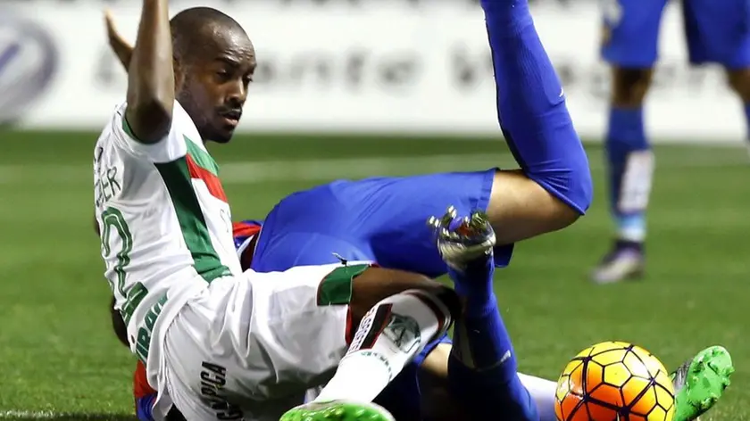 Granada CF's French Dimitri Foulquier (L) duels for the ball with UD Levante's striker Víctor Casadesús (R) during their Spanish Liga Primera Division soccer match played at Ciudad de Valencia stadium, in Valencia, eastern Spain, 12 December 2015. EFE/Juan Carlos Cardenas
