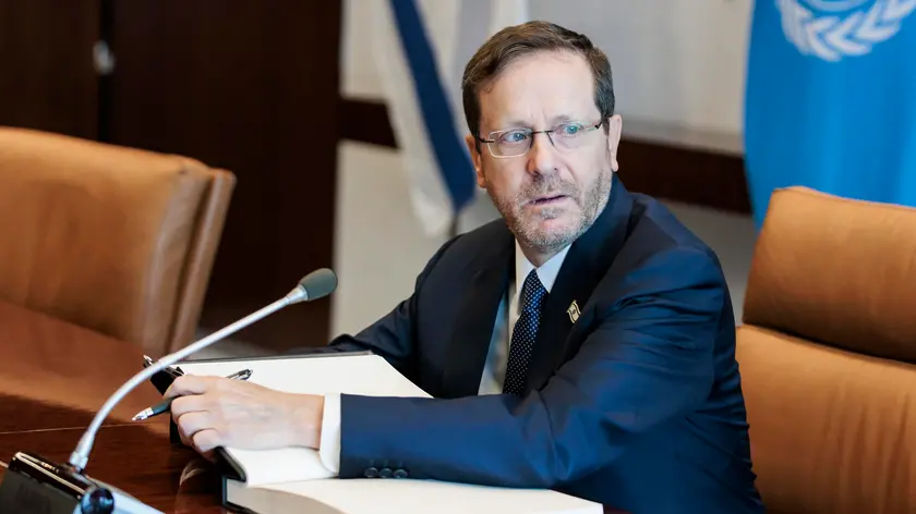 epa10758500 President of Israel Isaac Herzog signs a guest book at the start of a meeting with United Nations secretary-general at United Nations headquarters in New York, New York, USA, 20 July 2023. EPA/JUSTIN LANE