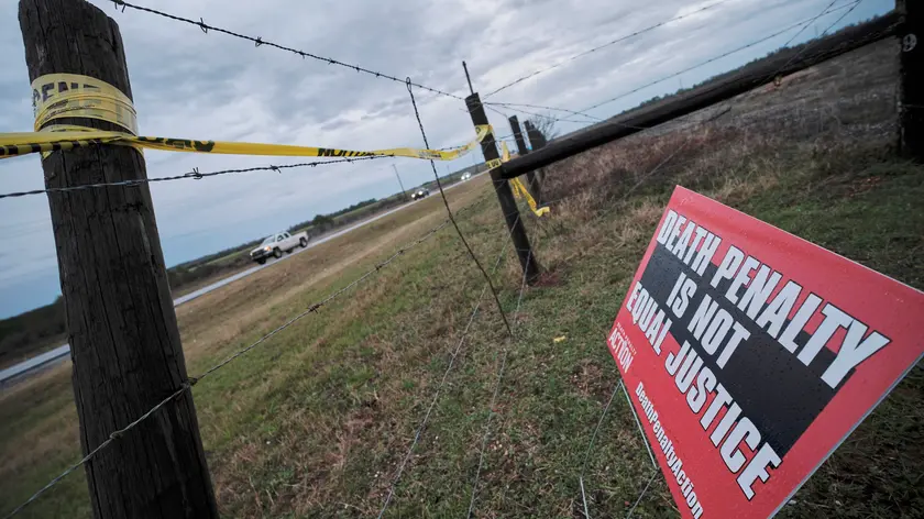 epa11104545 A protest sign against the death penalty is displayed outside of the W.C. Coleman Correction Facility where the State of Alabama is planning the execution of convicted killer Kenneth Eugene Smith in Atmore, Alabama, USA, 25 January 2024. There have been protests by several human rights groups who claim the experimental method of using nitrogen gas hypoxia to execute people may not work. EPA/DAN ANDERSON