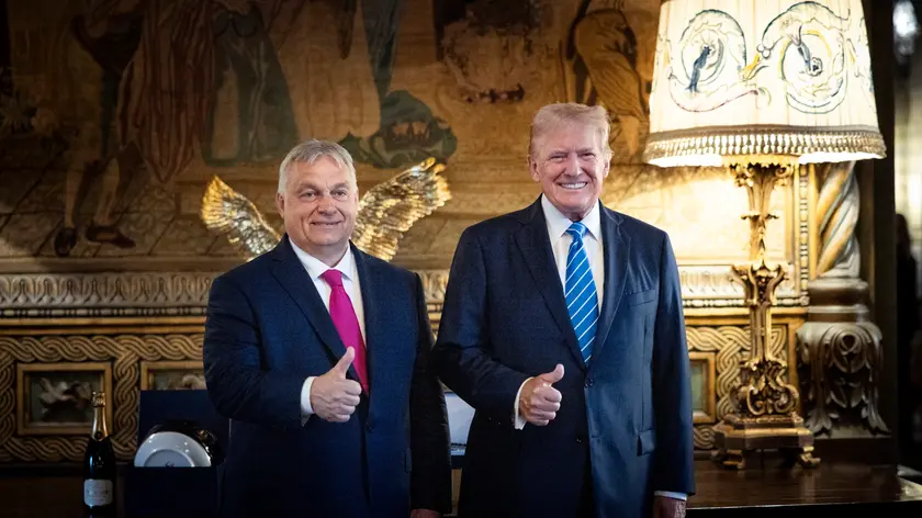 epa11473669 A handout photo made available bythe Hungarian PM’s Press Office shows Hungarian Prime Minister Viktor Orban (L) and former US president and Republican presidential candidate Donald Trump (R) posing for photographs during their meeting in Trump's Mar-a-Lago estate in Palm Beach, Florida, USA, 11 July 2024. EPA/Zoltan Fischer HANDOUT HUNGARY OUTHANDOUT EDITORIAL USE ONLY/NO SALES
