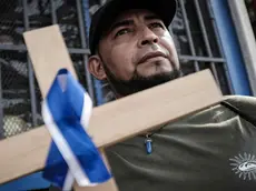 epa11240260 Nicaraguan citizens participate in a procession in San Jose, Costa Rica, 23 March 2024. The Catholic Church of Costa Rica celebrated this 23 March a Stations of the Cross for migrants, mainly Nicaraguans, for the release of the 'political prisoners' of Nicaragua' while praying for peace and for the persecuted priests in that Central American country. The viacrucis, attended by dozens of Nicaraguan migrants carrying, in some cases, the Nicaraguan flag and photographs of the 'political prisoners', left the San Isidro Labrador parish, in the Vazquez de Coronado canton, province of San Jose, Costa Rica, as confirmed by EFE. EPA/Jeffrey Arguedas