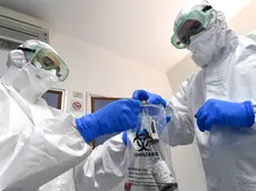 epa08179915 Medical staff of S. Martino hospital infectious disease department, with protective equipment on the isolation room, Genoa, Italy, 30 January 2020. The coronavirus, called 2019-nCoV, originating from Wuhan, China, has spread to all the 31 provinces of China as well as more than a dozen countries in the world. The outbreak of coronavirus has so far claimed at least 170 lives and infected more than 8,000 others, according to media reports. EPA/LUCA ZENNARO