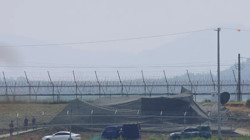 epa11401682 A military vehicle covered with a camouflage net, presumably carrying loudspeakers, is on standby near the inter-Korean border in Paju, 37 kilometers northwest of Seoul, South Korea, 10 June 2024. South Korea's Joint Chiefs of Staff (JCS) said on 09 June it conducted propaganda loudspeaker broadcasts near the border with North Korea in response to the North's recent launch of balloons carrying trash into the South. The North is estimated to have launched more than 1,600 trash-carrying balloons in the campaign that started on 28 May, however many failed to reach South Korea due to the wind direction, according to the JCS. EPA/YONHAP SOUTH KOREA OUT