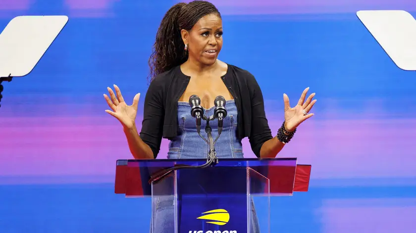 epa10826200 Former US First Lady Michelle Obama addresses the audience during a celebration of 50 Years of Equal Pay at the US Open Tennis Championships at the USTA National Tennis Center in Flushing Meadows, New York, USA, 28 August 2023. The US Open runs from 28 August through 10 September. EPA/CJ GUNTHER