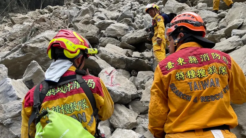 epa11259680 A handout photo made available by the Hualien County government shows rescuers working to retrieve the body of a woman under fallen rocks at Jiuqu cave in Taroko National Park in Hualien, Taiwan, 05 April 2024. The magnitude 7.4 earthquake on 03 April resulted in at least 10 fatalities and more than 1,000 injuries, with over 700 people trapped, and 11 people reported missing, according to Taiwan's National Fire Agency. EPA/HUALIEN COUNTY GOVEMENT HANDOUT EDITORIAL USE ONLY/NO SALES HANDOUT EDITORIAL USE ONLY/NO SALES