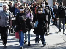 Tourists wearing protective face masks visit Rome, Italy, 26 February 2020. ANSA / ETTORE FERRARI