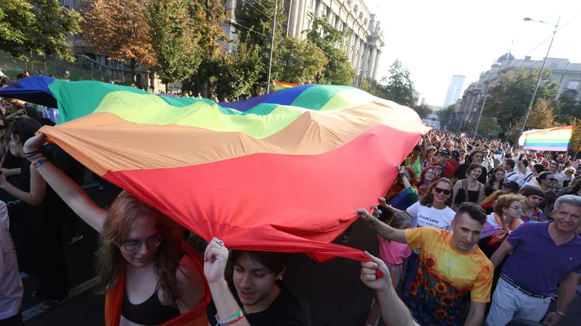 epa11591821 Participants wave a giant rainbow colored flag during the Belgrade Pride Parade march in Belgrade, Serbia, 07 September 2024. Holding rainbow colored flags, balloons and banners participants marched through the main streets of Serbia's capital near the main institutions in the city to which Belgrade Pride has been addressing its demands for improved rights for the LGBTQ+ community. EPA/ANDREJ CUKIC