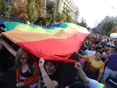 epa11591821 Participants wave a giant rainbow colored flag during the Belgrade Pride Parade march in Belgrade, Serbia, 07 September 2024. Holding rainbow colored flags, balloons and banners participants marched through the main streets of Serbia's capital near the main institutions in the city to which Belgrade Pride has been addressing its demands for improved rights for the LGBTQ+ community. EPA/ANDREJ CUKIC