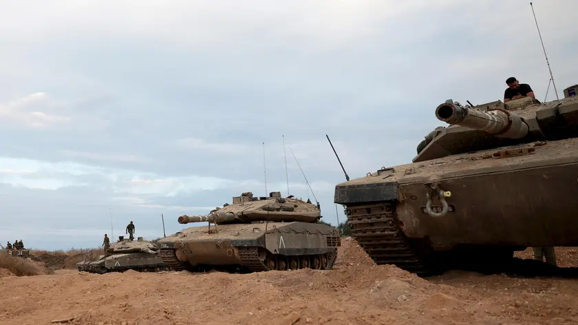 epa10948891 An Israeli military unit with tanks during maneuvers in the Western Galilee, as they guard along the border with Lebanon, northern Israel, 30 October 2023. Tensions remain high at the border between Israel and Lebanon after the Israeli-Palestinian conflict escalated following an unprecedented attack carried out by Hamas militants from Gaza into Israel on 07 October 2023. EPA/ATEF SAFADI