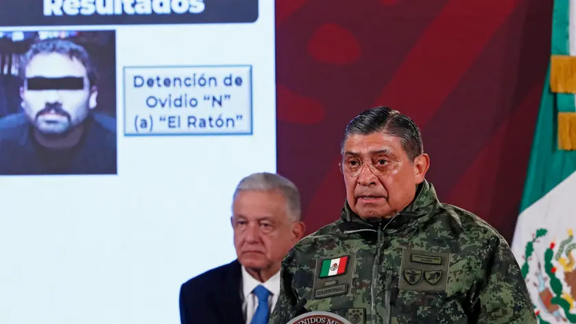 epa10392433 Mexican Secretary of National Defense Luis Cresencio Sandoval speaks during a morning press conference at the National Palace in Mexico City, Mexico, 06 January 2023. At least 29 people were killed in a wave of violence that swept northern Mexico following the arrest of Ovidio 'El Raton' Gumzan, one of the sons of notorious drug lord Joaquin 'El Chapo' Guzman. Cresencio Sandoval said 10 of those killed were members of the Mexican Armed Forces and 19 belonged to the heavily armed criminal organizations that sparked the violence. EPA/Jose Mendez