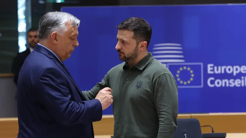 epa11441355 Hungarian Prime Minister Viktor Orban (L) and Ukraine's President Volodymyr Zelensky (R), take part at signature ceremony of security agreement with the EU, during European Council in Brussels, Belgium, 27 June 2024. EU leaders are gathering in Brussels for a two-day summit to discuss the Strategic Agenda 2024-2029, the next institutional cycle, Ukraine, the Middle East, competitiveness, security and defense, among other topics. EPA/OLIVIER HOSLET / POOL