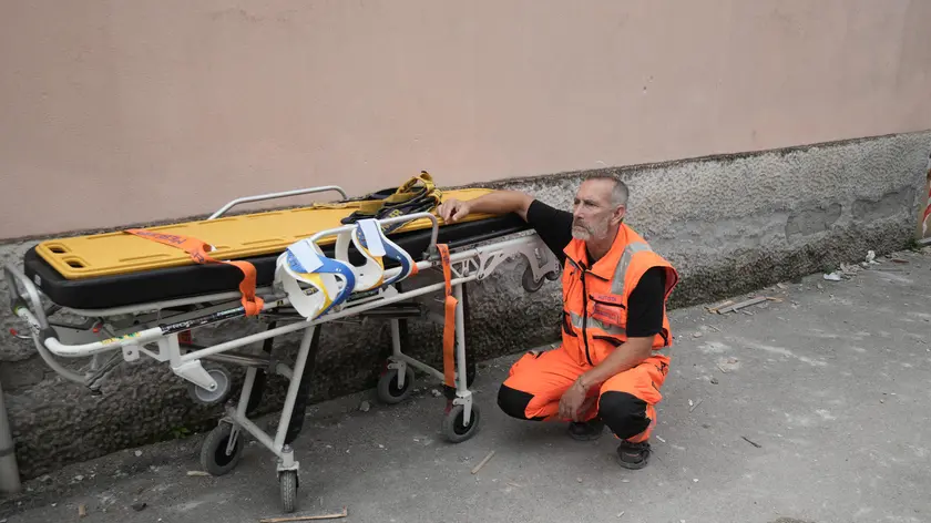 Search and rescues work in the collapse of the building in Saviano, Naples district, Italy, 22 September 2024. Two siblings aged four and six are dead after an apartment building collapsed in the town of Saviano, near Naples, on Sunday. Rescuers are searching in the rubble for the children's mother and an elderly woman, who lived in the same building. The children's father and their two-year-old brother were pulled out of the rubble alive. The father is in a critical condition in hospital while the boy is not in a life-threatening condition, sources said. It is suspected that the explosion of a gas cylinder caused the building to collapse. ANSA/CESARE ABBATE