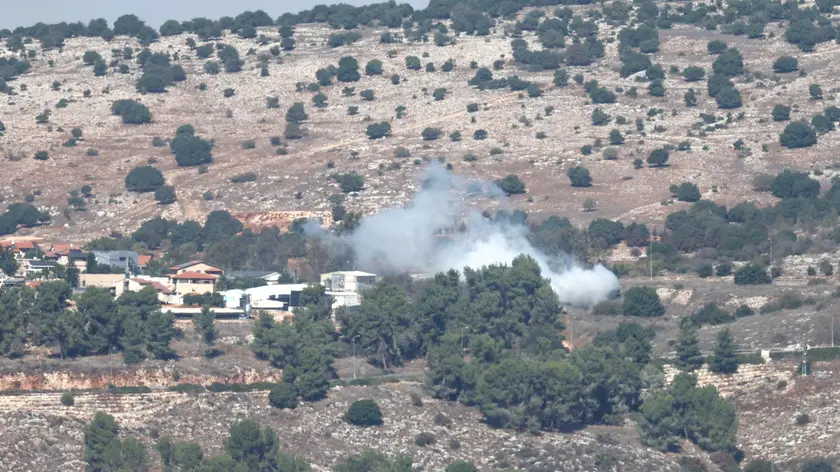epa10938254 Smoke rises in the Israeli village of Avivim as a result of an anti-tank missile fired from Lebanon, 25 October 2023. According to an Israeli army spokesperson an anti-tank missile was launched from Lebanon towards Israeli soldiers in the area of Avivim. No injuries have been reported. In response, Israeli army tanks and artillery fired back at the source of the attack. EPA/ATEF SAFADI