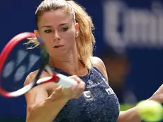 epa10827490 Camila Giorgi of Italy returns to Jessica Pegula of the United States during their first round match at the US Open Tennis Championships at the USTA National Tennis Center in Flushing Meadows, New York, USA, 29 August 2023. The US Open runs from 28 August through 10 September. EPA/WILL OLIVER