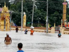 epaselect epa11603206 People carry their belongings at they wade through the flood in Taungoo, Bago division, Myanmar, 14 September 2024. Heavy rains triggered by Typhoon Yagi have caused severe flooding in parts of Myanmar, leaving thousands stranded in their homes, with further heavy rainfall and thunderstorms expected, according to the state weather office. A statement from the Military announced 59,413 households were affected in 34 townships and set up 187 relief camps for the 236,649 people. There were 33 casualties due to the flood in the country including the Naypyitaw. EPA/NYEIN CHAN NAING