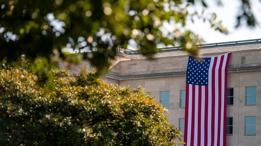 epa11598558 The American flag hangs from the Pentagon during the observance ceremony for the 23rd anniversary of the 9/11 terror attack at the Pentagon in Arlington, Virginia, USA, 11 September 2024. Later in the day, US President Joe Biden and Democratic Presidential nominee Vice President Kamala Harris will lay a wreath at the Pentagon 9/11 Memorial. EPA/SHAWN THEW