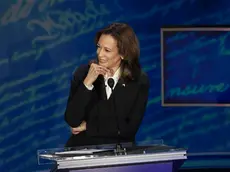 epa11597550 Democratic presidential candidate US Vice President Kamala Harris listens to Republican presidential candidate Donald J. Trump during a presidential debate hosted by ABC News at the National Constitution Center in Philadelphia, Pennsylvania, USA 10 September 2024. The 90 minute event is the only planned debate between the two candidates in the 2024 presidential election. EPA/DEMETRIUS FREEMAN / POOL