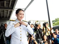 epa11553715 Thailand's newly elected Prime Minister Paetongtarn Shinawatra adjusts her dress upon her arrival to receive the royal command appointment to become prime minister, at the Pheu Thai Party's headquarters in Bangkok, Thailand, 18 August 2024. The ruling Pheu Thai Party leader Paetongtarn Shinawatra, the youngest daughter of the coup-ousted former premier Thaksin Shinawatra, succeeded in the parliamentary vote to become Thailand's 31st prime minister and the country's youngest prime minister in history. EPA/RUNGROJ YONGRIT