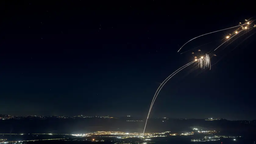 epa11523725 Projectiles fired from the Israeli Iron Dome air defense system intercept missiles fired from southern Lebanon, over the upper Galilee, northern Israel, early 04 August 2024. The Israeli army reported that around 50 missiles were launched from southern Lebanon into Israel territories. On 03 August the IDF had reported to have struck Hezbollah targets in southern Lebanon. EPA/ATEF SAFADI