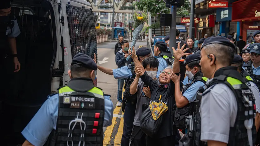 epaselect epa11388554 Alexandra Wong (C, white hair), an activist known as Grandma Wong, is led to a police van after being detained by police officers at Causeway Bay near Victoria Park in Hong Kong, China, 04 June 2024. For almost three decades, people in Hong Kong commemorated the 04 June anniversary of China's deadly crackdown on protesters in Tiananmen Square with a noisy candlelit vigil in the city's Victoria Park. Now the subject is so sensitive, that nearby Victoria Park had been the site of an annual remembrance of the crackdown at Tiananmen Square, the event has no longer taken place since the new national security law came into effect. EPA/LEUNG MAN HEI