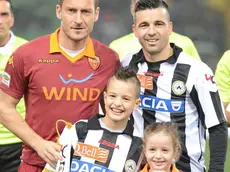 Italian forward and captain of AS Roma, Francesco Totti (L), poses for a photo with Italian forward and captain of Udinese, Antonio Di Natale, prior the Italian Serie A soccer match Udinese Calcio vs AS Roma at Friuli stadium in Udine, Italy, 09 March 2013..ANSA/LUCIANO ROSSI/AS ROMA