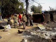 epa05149785 Nigerian women gather their belongings to depart the village of Mairi in the Konduga local government area of Borno State, North-East Nigeria following Boko Haram attacks over the weekend, Nigeria 08 February 2016. Three women and one man were killed during the attack which led to the destruction of the village. Nigerian military have been carrying out operations against Boko Haram following the recent Boko Haram attacks. Boko Haram insurgents have been waging a terror campaign in Northeast Nigeria for over 5 years. EPA/STRINGER