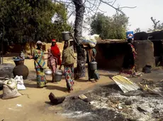 epa05149785 Nigerian women gather their belongings to depart the village of Mairi in the Konduga local government area of Borno State, North-East Nigeria following Boko Haram attacks over the weekend, Nigeria 08 February 2016. Three women and one man were killed during the attack which led to the destruction of the village. Nigerian military have been carrying out operations against Boko Haram following the recent Boko Haram attacks. Boko Haram insurgents have been waging a terror campaign in Northeast Nigeria for over 5 years. EPA/STRINGER