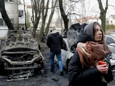 epa11233154 Ukrainians are at the scene of a missile strike in Kyiv, Ukraine, 21 March 2024, amid the Russian invasion. According to the State Emergency Service of Ukraine (SESU), rockets hit the capital's Podilsk, Shevchenkiv and Sviatoshyn districts in the morning of 21 March, damaging residential buildings and injuring at least 10 people. No casualties had yet been reported. EPA/SERGEY DOLZHENKO