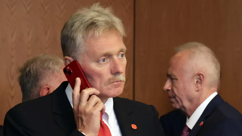 epa11581820 Kremlin's spokesman Dmitry Peskov (C) uses his phone during the meeting of the Russian president with the Mongolian prime minister in Ulaanbaatar, Mongolia, 03 September 2024. Putin visits Mongolia in his first trip to a member state of the International Criminal Court (ICC) since the court issued an arrest warrant for him last year. EPA/VYACHESLAV PROKOFIEV / SPUTNIK / KREMLIN POOL / POOL
