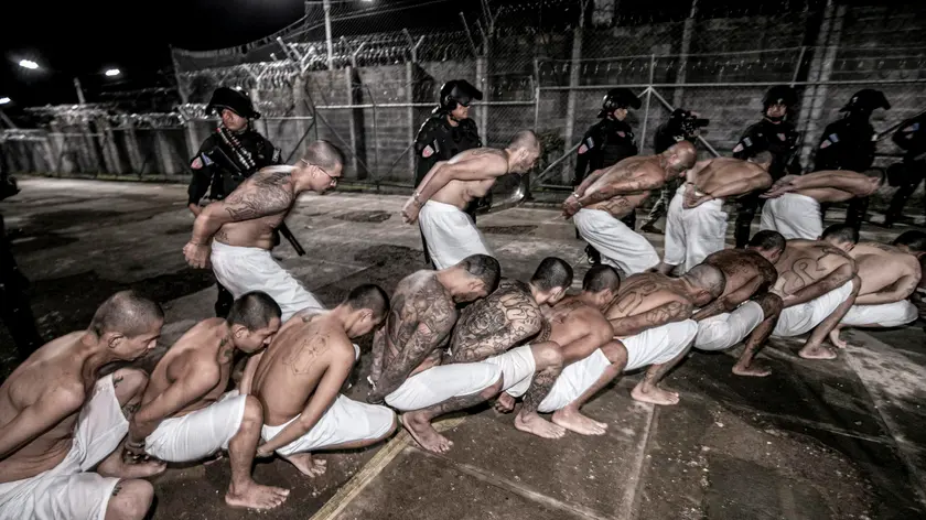 epa11405088 A handout photo made available by the Government of El Salvador shows the transfer of gang members to the Confinement Center for Terrorism (Cecot) in Tecoluca, El Salvador, 11 June 2024. El Salvador's President Nayib Bukele said that another 2,000 gang members were transferred to the country's high-security prison, called the Confinement Center for Terrorism (Cecot), which has a capacity of 40,000 members for these criminal structures and, according to Bukele is ''the largest in the Americas''. EPA/GOVERNMENT OF EL SALVADOR / HANDOUT HANDOUT/ EDITORIAL USE ONLY/ ONLY AVAILABLE TO ILLUSTRATE THE ACCOMPANYING NEWS (MANDATORY CREDIT) HANDOUT EDITORIAL USE ONLY/NO SALES HANDOUT EDITORIAL USE ONLY/NO SALES