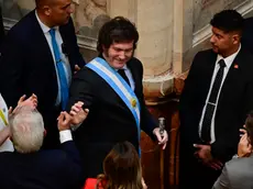 epa11192600 President Javier Milei (C) arrives to inaugurate the ordinary sessions in the Chamber of Deputies, in Buenos Aires, Argentina, 01 March 2024. Milei denounced that populism stole a good part of the population's income when reviewing the "inheritance" received from the administration of Peronist Alberto Fernandez (2019-2023). EPA/Matias Martin Campaya