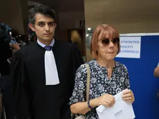 epa11609845 Gisele Pelicot (C), escorted by her lawyer Stephane Babonneau (L) exits under public aplause at the criminal court in Avignon, southern France, 17 September 2024, where her ex-husband stands trial. Dominique Pelicot is accused of drugging and raping his then-wife Gisele Pelicot while she was unconscious. He is also charged with offering her to dozens of men at their home in Mazan, France between 2011 and 2020. Fifty other men are facing trial for their alleged involvement. Pelicot could face a maximum sentence of 20 years in prison if convicted. The trial resumed on 17 September after a delay due to Dominique Pelicot's health concerns. EPA/GUILLAUME HORCAJUELO