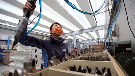 A worker of the Polini company at work wearing a protective mask, Alzano Lombardo, Bergamo, 06 March 2020. The factory is located in Alzano Lombardo one of the villages in the province of Bergamo which risks becoming "red zone" due to the spread of Coronavirus.. According to official figures the number of Coronavirus cases in Italy, the center of Europe's COVID-19 outbreak, was at 3,858 cases by 06 March with a death toll of 148 people while 414 people have recovered since the outbreak. ANSA/MATTEO BAZZI