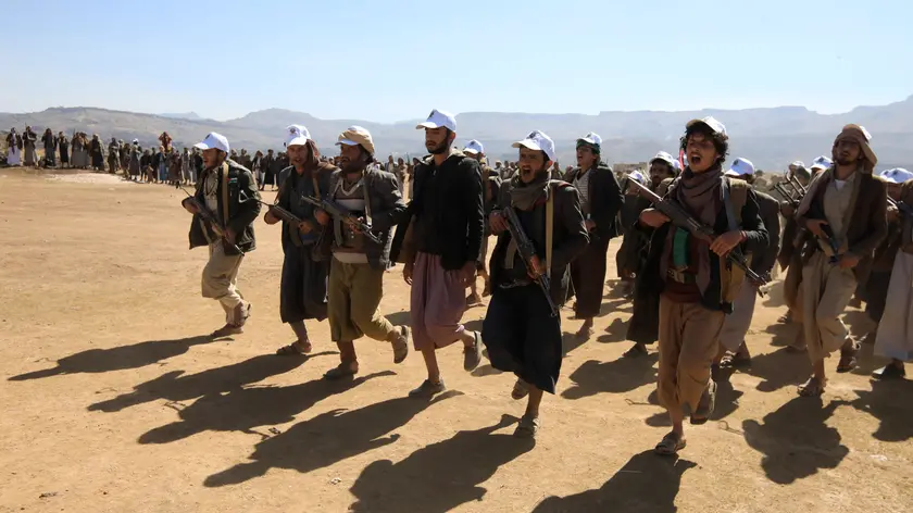 epa11096562 Newly-recruited members of the Houthis' popular army march during a gathering at the end of a military training, on the outskirts of Sana'a, Yemen, 22 January 2024. Yemen's Houthis have mobilized and recruited thousands of tribal militiamen as part of the creation of a popular army dedicated to a possible confrontation with Israel amid fears of a wider regional conflict stemming from the Israel-Hamas conflict. The Houthis have vowed to keep up attacks on ships in the Red Sea and the Gulf of Aden, with the aim of ending the Israeli bombardment of the Gaza Strip, and in response to US-led retaliatory strikes. The US Department of State on 17 January announced the designation of Yemen's Houthis as a 'Specially Designated Global Terrorist group' amid an escalation of their attacks on shipping lanes in the Red Sea, the Bab al-Mandab Strait, and the Gulf of Aden since November 2023. The US Department of Defense announced in December 2023 a multinational operation to safeguard trade and protect ships in the Red Sea amid the escalation in Houthi attacks. EPA/YAHYA ARHAB