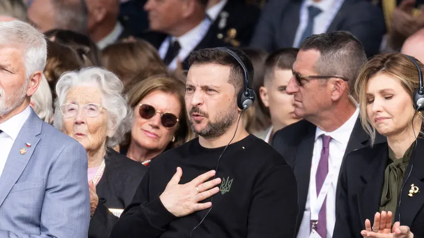 epa11393925 Ukraine's President Volodymyr Zelensky reacts during the speech of French President Emanuel Macron at the commemorative ceremony with dozens of heads of States and more than 200 veterans for the 80th anniversary of D-Day landings in Normandy at Omaha Beach, Saint-Laurent-sur-Mer, France, 06 June 2024. More than 160,000 Western allied troops landed on beaches in Normandy on 06 June 1944 launching the liberation of Western Europe from Nazi occupation during World War II. EPA/ANDRE PAIN