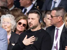 epa11393925 Ukraine's President Volodymyr Zelensky reacts during the speech of French President Emanuel Macron at the commemorative ceremony with dozens of heads of States and more than 200 veterans for the 80th anniversary of D-Day landings in Normandy at Omaha Beach, Saint-Laurent-sur-Mer, France, 06 June 2024. More than 160,000 Western allied troops landed on beaches in Normandy on 06 June 1944 launching the liberation of Western Europe from Nazi occupation during World War II. EPA/ANDRE PAIN