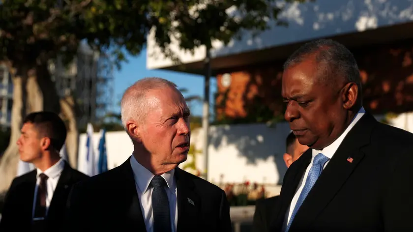 epa10511637 Israel's Defense Minister Yoav Gallant (C) and US Secretary of Defense Lloyd Austin (R) leave the venue after a joint statement following their bilateral meeting at Ben Gurion airport, near Tel Aviv, Israel, 09 March 2023. Secretary Austin arrived to Israel as part of a regional tour that includes Egypt, Iraq and Jordan. EPA/ATEF SAFADI