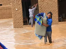 epa11567852 People salvage their belongings at a flood-affected area, in Masawi, the northern state of Merowe, Sudan, 27 August 2024. According to the United Nations Office for the Coordination of Humanitarian Affairs (OCHA) in Sudan, at least 30 people have died after the Arba'at Dam, located approximately 38 km northwest of Port Sudan in Sudan's Red Sea State, was extensively damaged on 25 August due to heavy rains. Some 50,000 people living on the western side of the Dam have been severely affected, according to local authorities. OCHA figures state the floods affecting Sudan since July 2024 had already displaced at least 118,000 people prior to the dam collapse, and 317,000 were already affected across 16 of the 18 Sudanese states. EPA/STR