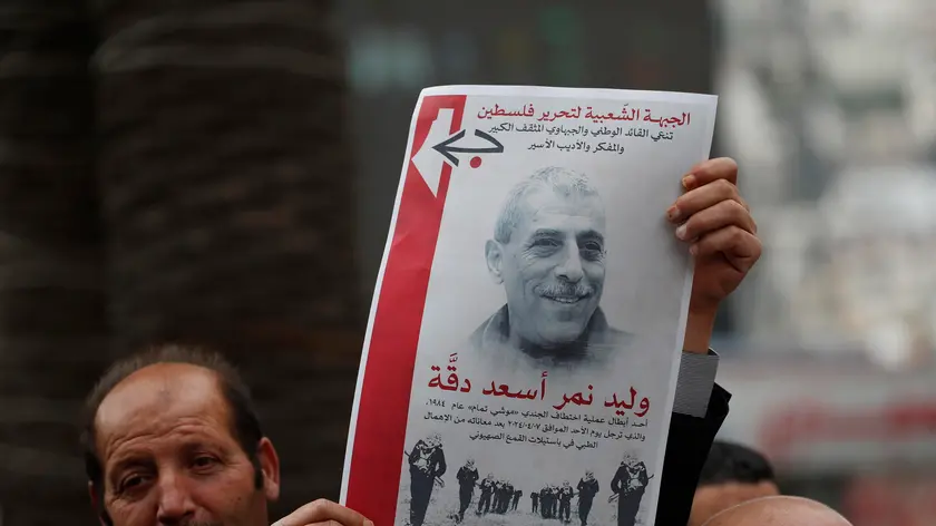 epa11265567 People protest following the death in an Israeli jail of terminally ill Palestinian activist and novelist Walid Daqqa, in the West Bank City of Nablus, 08 April 2024. Walid Daqqa, who spent 39 years in Israeli prisons and had cancer, died on 07 April 2024 in the Israeli Assaf Harofeh Hospital following “years of deliberate medical negligence by the Israeli prison administration”, according to a statement by the Detainees and Ex-Detainees' Affairs Commission and the Palestinian Prisoner’s Society (PPS). EPA/ALAA BADARNEH